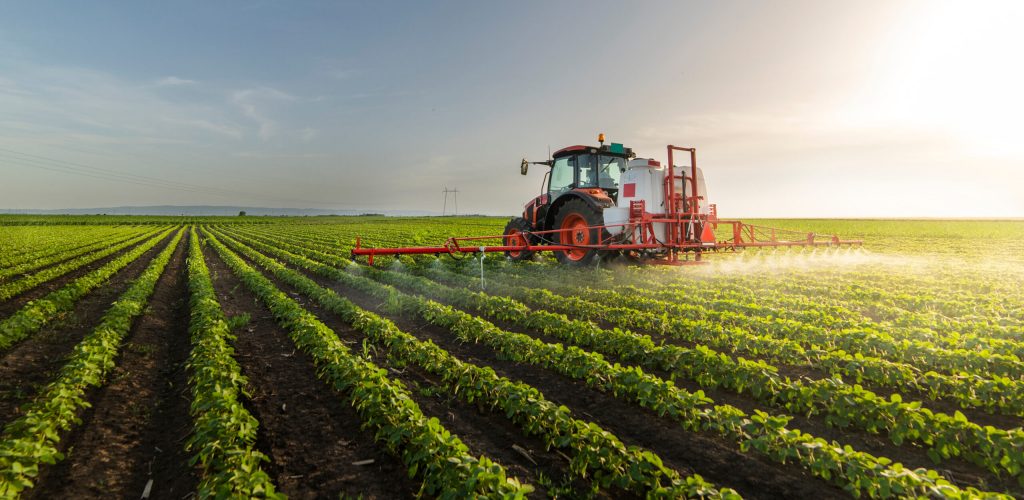 Tractor,Spraying,Pesticides,On,Soy,Field,With,Sprayer,At,Spring